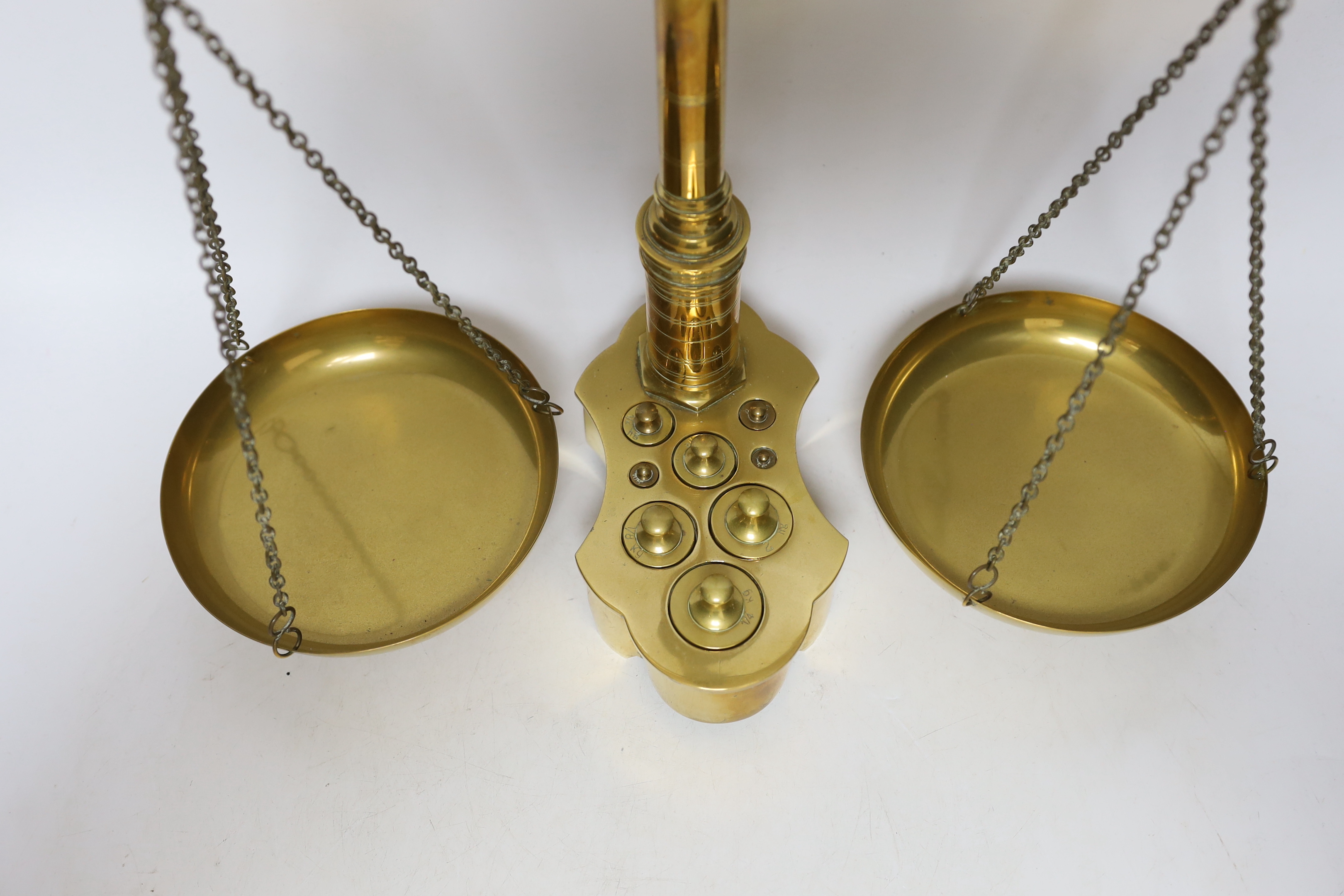 A set of brass kg scales, and integral weights, 55cm high